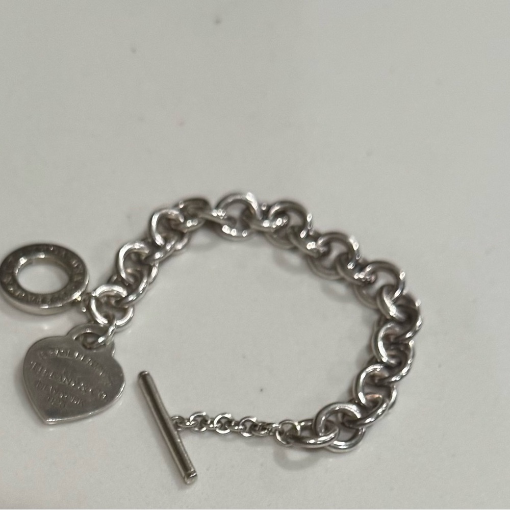 Tiffany & Company Sterling Silver Bracelet with Heart Charm.